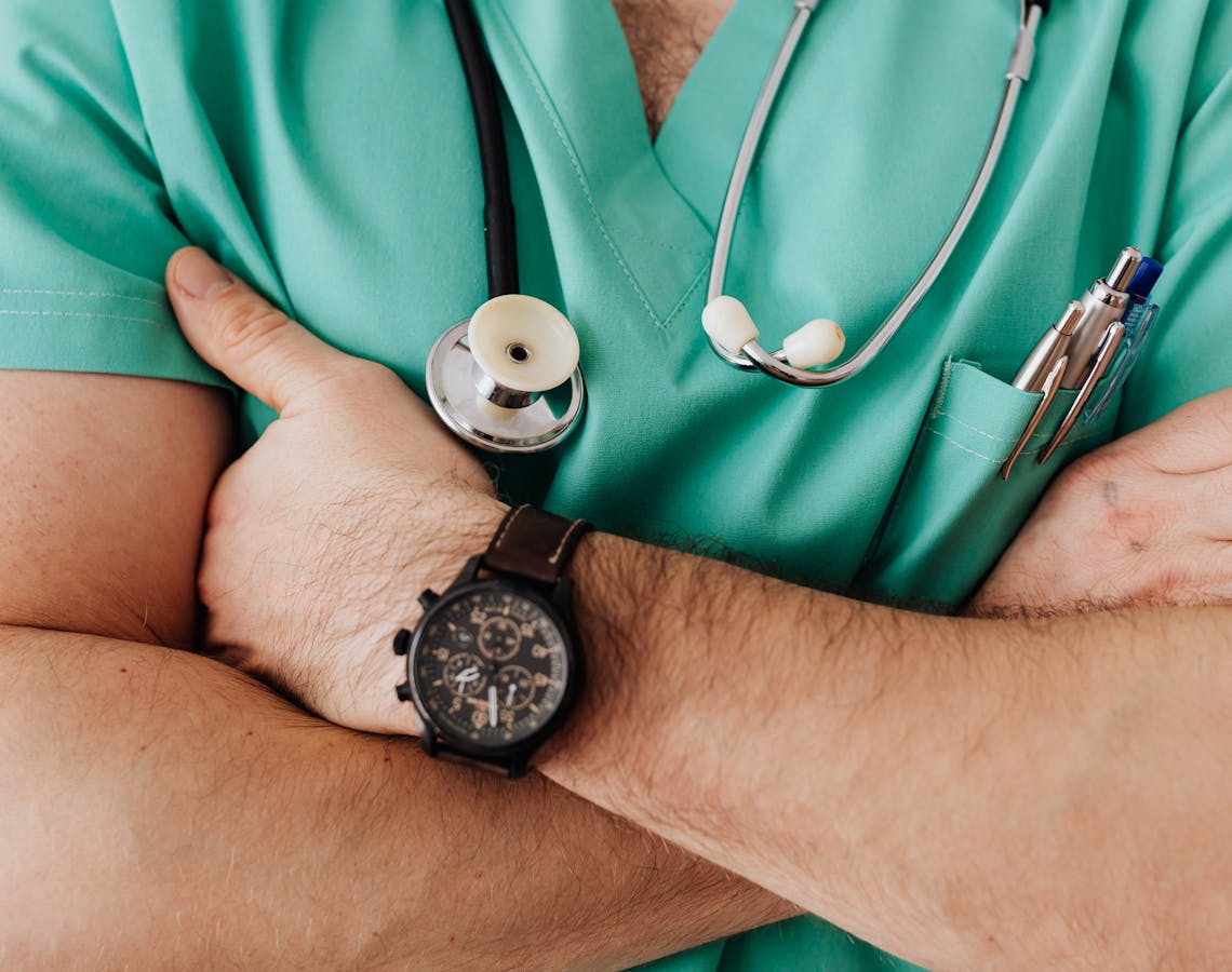 Crop unrecognizable male doctor with stethoscope